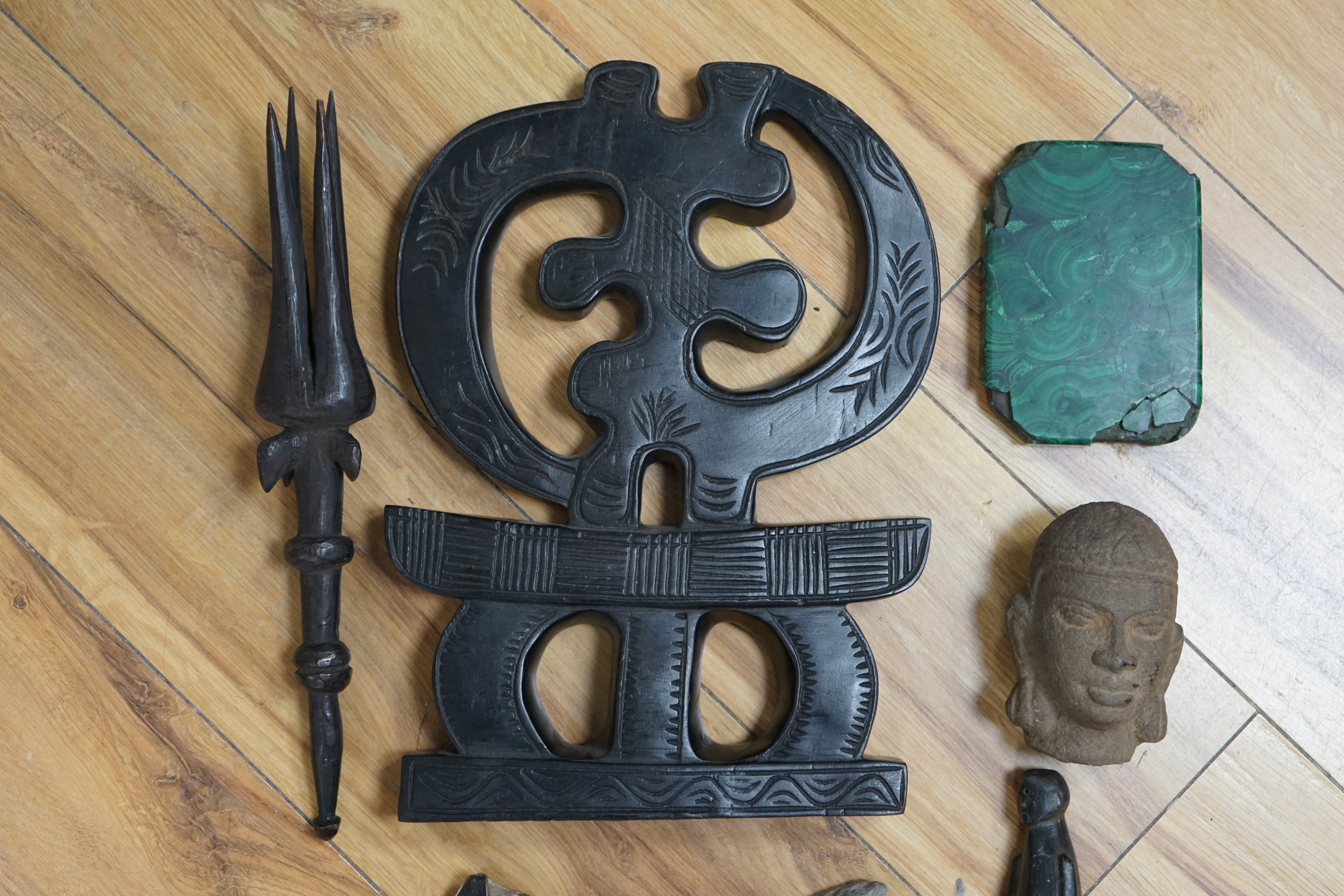 A flint axe, an inuit horn carving, a South American tribal stone head, a malachite panel, another stone carving and Chinese stand, largest 32cm. Condition - varies